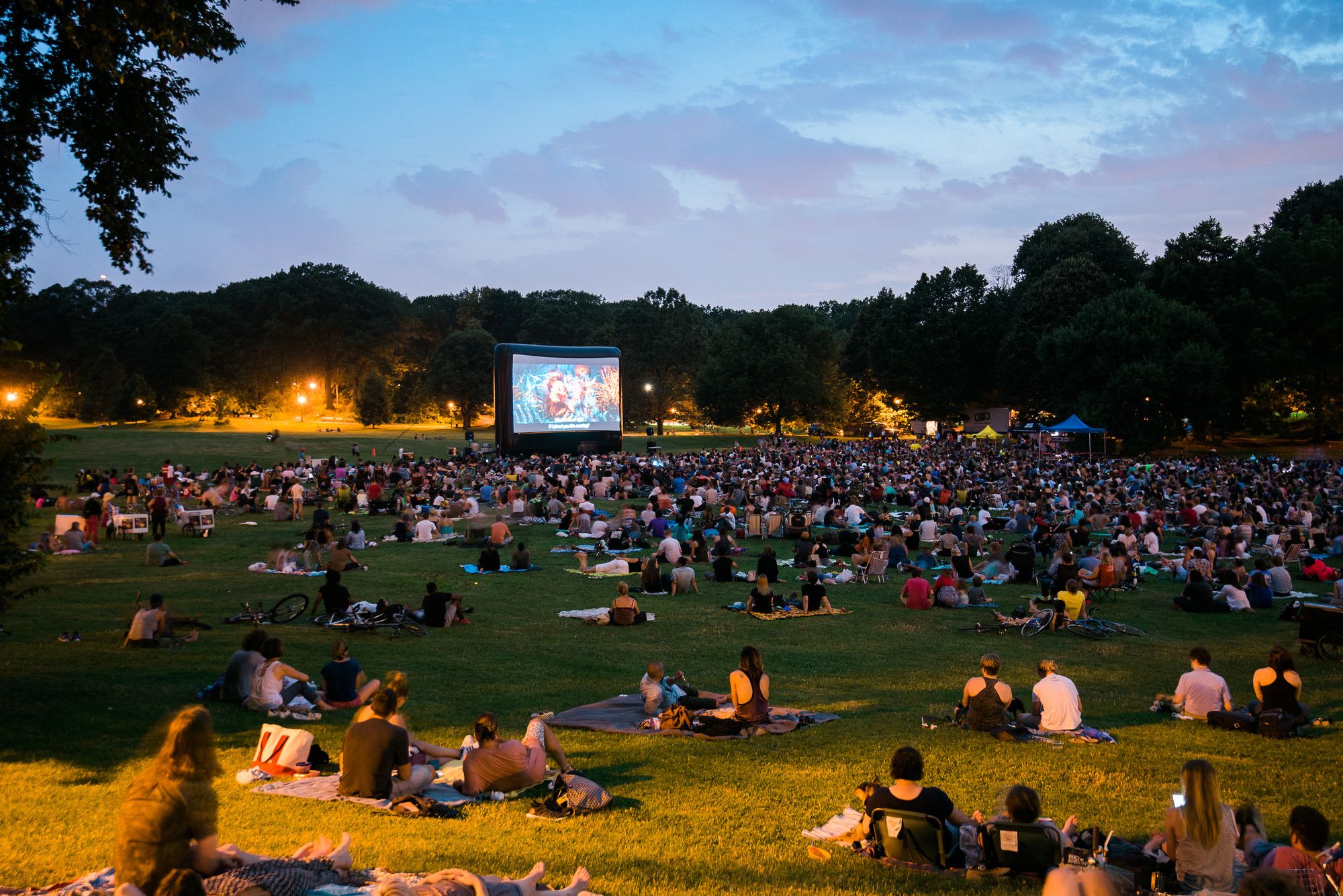 People watching a movie outdoors