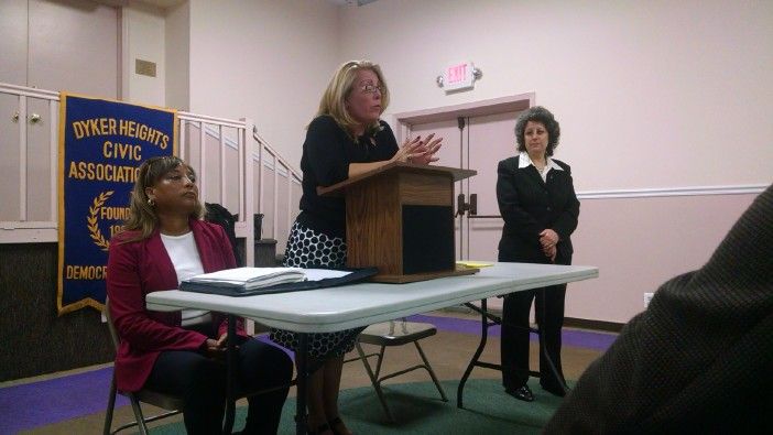 Lucretia Regina-Potter speaking at the debate. Pamela Harris sits to her right. (Photo by Bensonhurst Bean)
