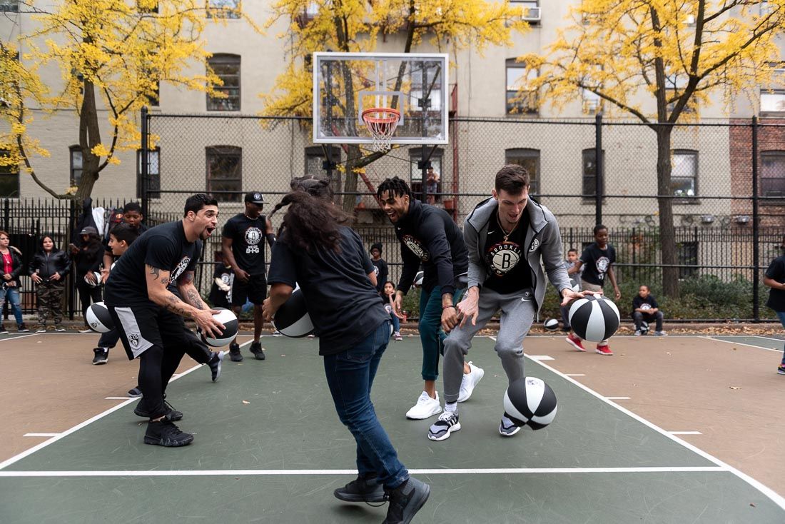 Brooklyn Nets Hand Out Basketballs, Run Drills With Local Youth on “Biggie” Courts