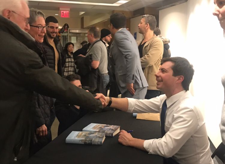 Pete Buttigieg signing books after his talk inside the Dr. S. Stevan Dweck Cultural Center at the Brooklyn Public Library (Photo: Kadia Goba/Bklyner)