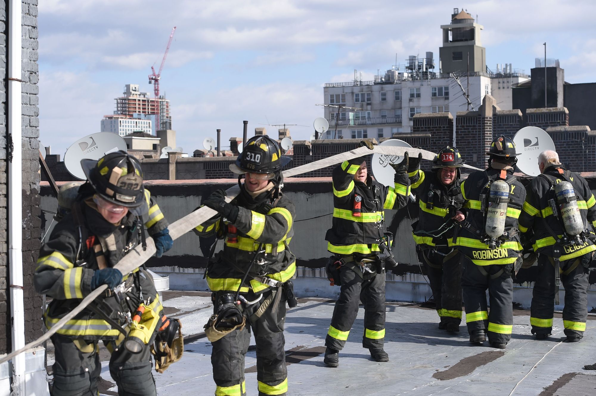 Firefighters on scene at on the roof of a six-story apartment building at 180 East 18th Street in Ditmas Park Monday morning after a blaze erupted destroying much of the top floor apartments. By Maisel/Bklyner