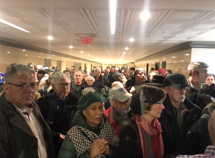 Crowd gathers outside of a the NYC Dept. of Planning hearing room ahead of the 960 Franklin Avenue Rezoning scoping meeting. Photo: Kadia Goba/Bklyner