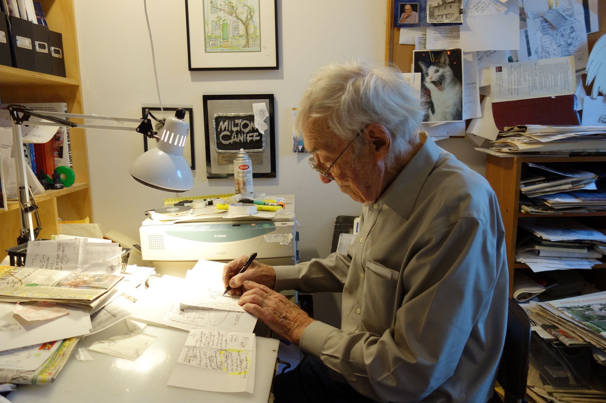 George Booth at his draft desk in his Lincoln Place apartment (Photo: Kadia Goba/Bklyner)