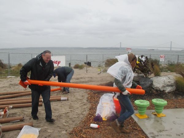 Despite Downpour, Seagate Residents Rebuild Playground Destroyed By Sandy