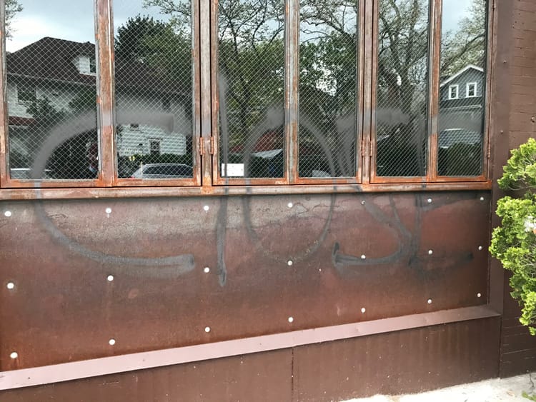 Rusty Nail Vandalized With “Stay Close” Graffiti