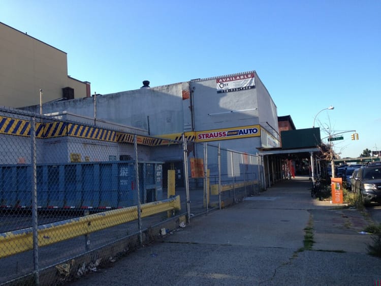 Scaffolding Up Around Former Strauss Auto, Demo Coming Soon To Make Way For 12-Story Residential Building