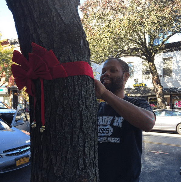 Photo Finish: Tie A Red Ribbon And Bell On An Old Street Tree