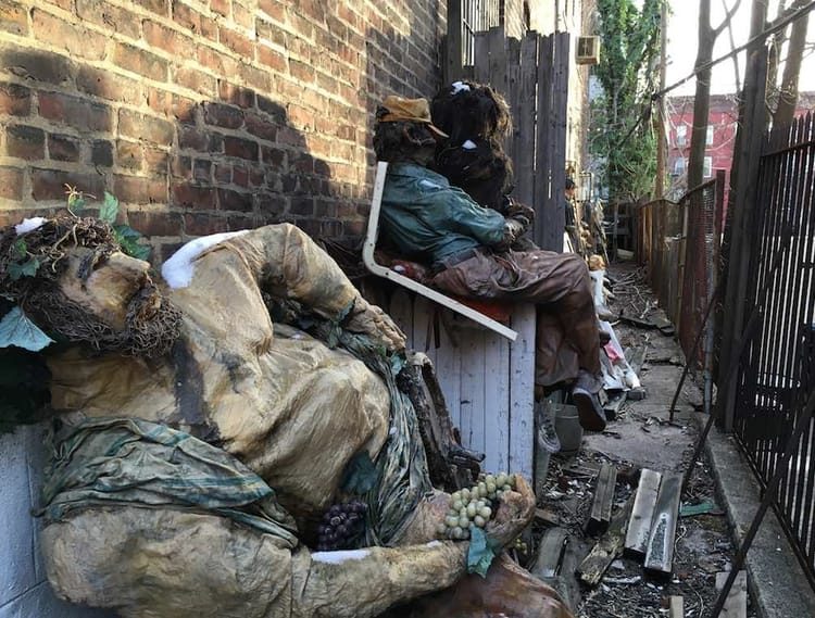 What The Heck Are These Giant, Creepy Papier-Mâché People Doing In A Garfield Place Alley?