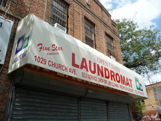 Old Sign Uncovered on Church Ave