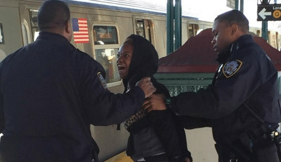 Woman Attacks Q Train Passenger, Hurls ‘Racial Profanities’ During Arrest