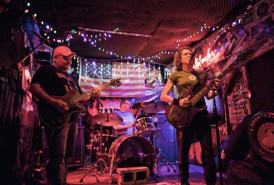 Concert Review: Punk Band Perp Walk Features NY1’s Roger Clark In Vivacious Trio