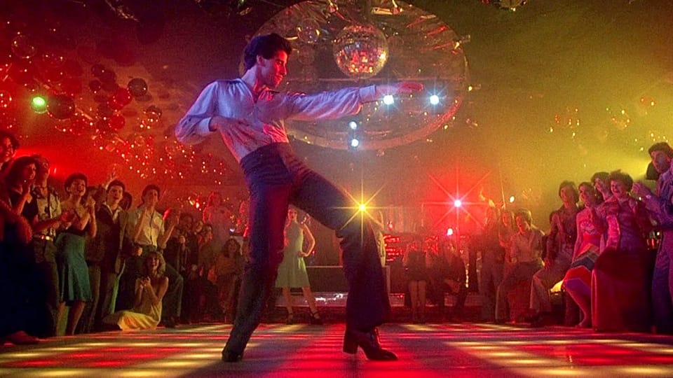 Filming “Saturday Night Fever”: Local Recalls Producers Paying Protection Money, Bomb Threat To Disco