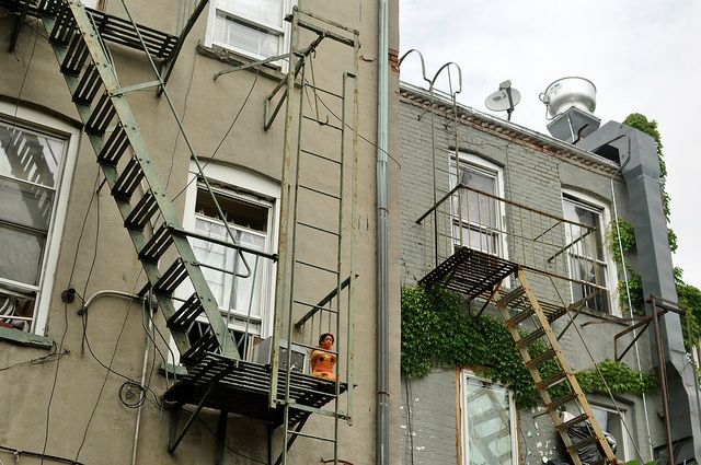 Lady on a Fire Escape