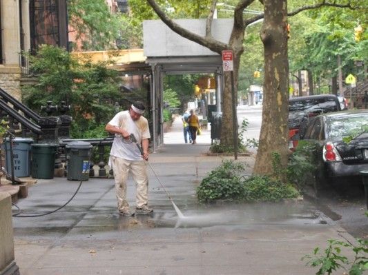 Washing the sidewalk