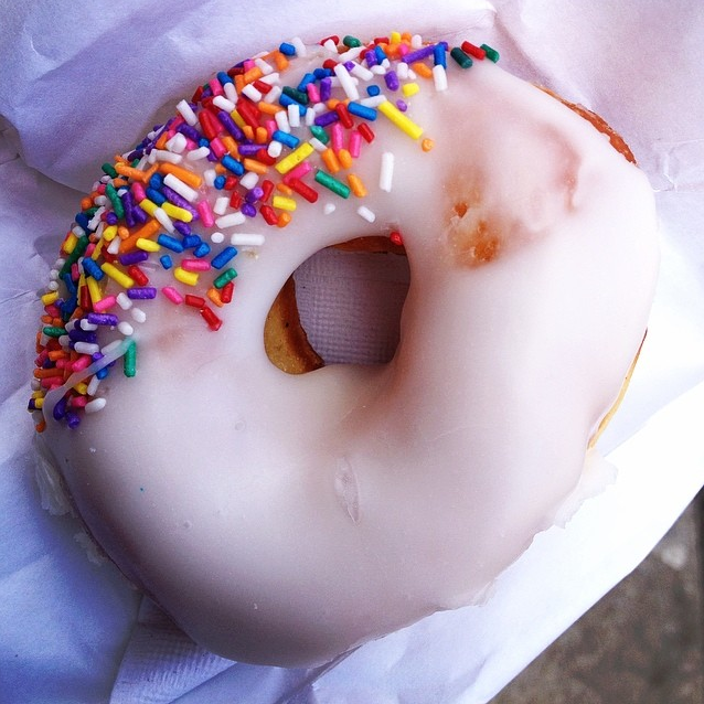 vanilla frosted donut with sprinkles from 7th Avenue Diner & Donuts