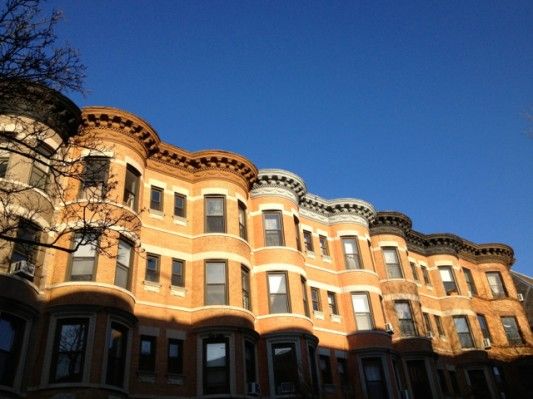 Blue skies over rowhouses on Carroll Street