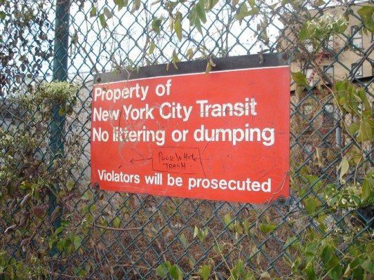 East 18th St Lot No Dumping Sign