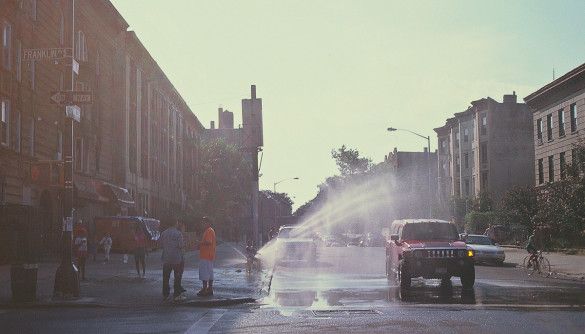 A johnny pump brings relief to the 'hood on a hot summer day. Photo by Brandon Barron