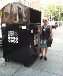 City Council Candidate Scavo Next To a huge donation bin