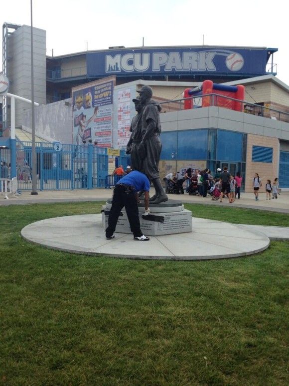 A worker removing the graffiti (Source: Glennschuck via twitter)