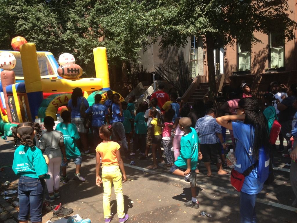 Kids lined up for a bouncy house at the 88th Precinct's 38th annual National Night Out Against Crime. (Photo by Amanda Woods)