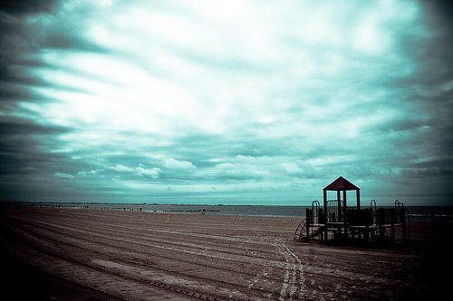 empty coney island beach by .Vini