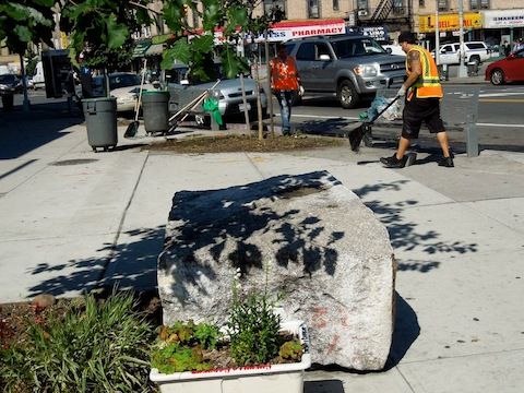 John Imbriale and Sanitation staff cleaning tree pits at Kensington Plaza