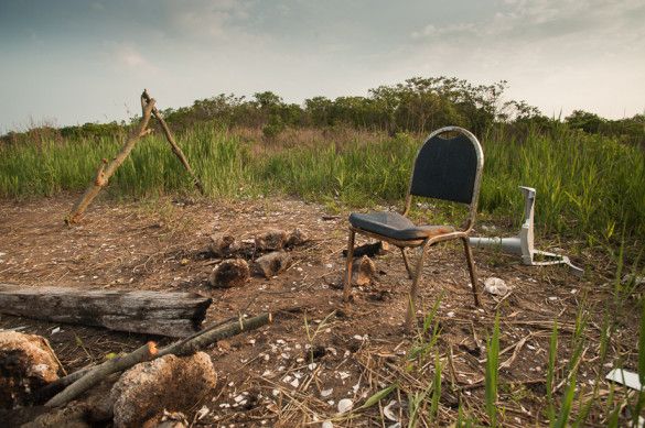 Chair and miscellaneous objects, Marine Park Salt Marsh. (Photo by Adiran Kinloch via Slate)