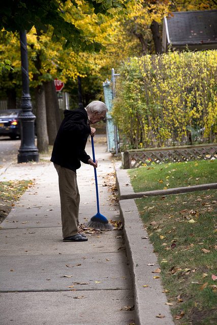 man sweeping by Chris Bowman