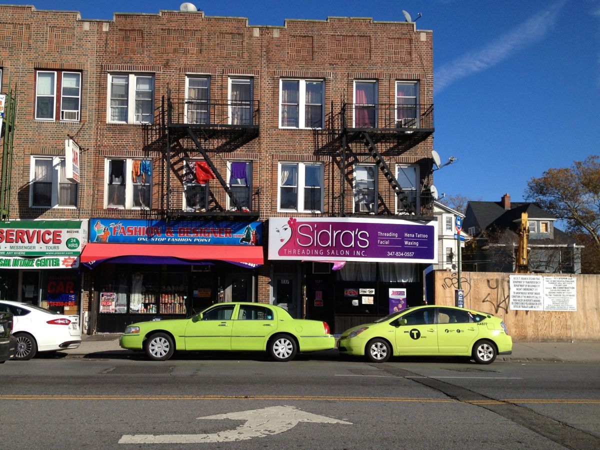 Fake green taxi and real green outer borough taxi cab