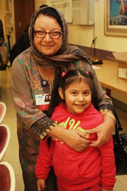 A CIH community affairs member with a patient during the turkey raffle.