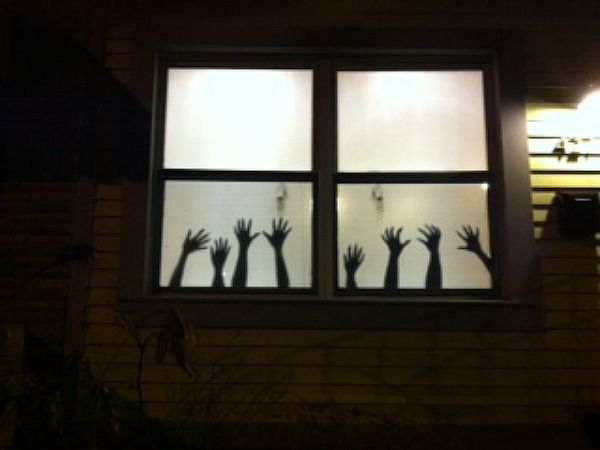 shadow hands in window