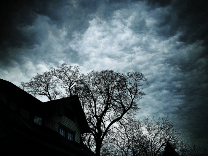 house, clouds, and branches by Andrew B. White