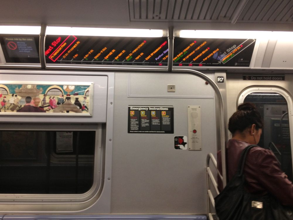 Subway F train sign passenger