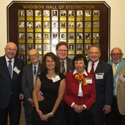 Honorees, or family members representing those who have passed away, stand with Principal  Jodie Cohen. Photo by Steve Mekler