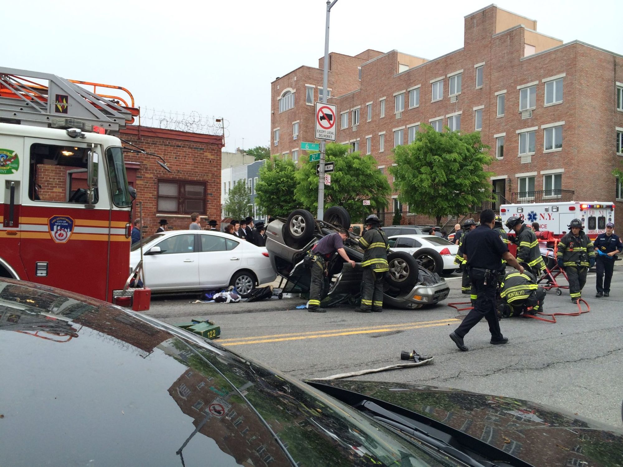 Car Flips On 6th Avenue, Sends Two To Hospital