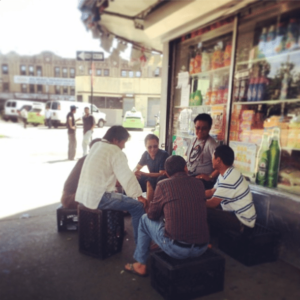 men sitting on newkirk avenue via ditmasparkcorner