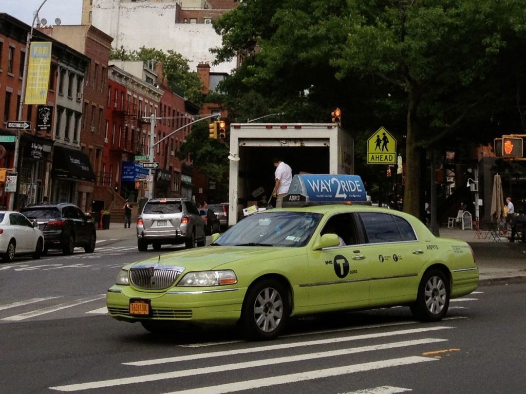 A green taxi cab. 