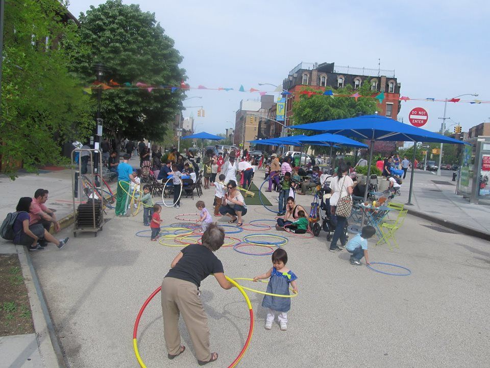 hula hooping kids at putnam triangle plaza via fab alliance