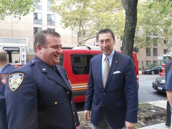 Commisioner Nigro with NYPD Detective William O'Connor, Jr., the son of one of the fallen firefighters.  (Photo by Mike T. Wright)