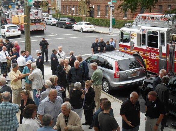 Attendees gather in front of the church after the service. (Photo by Mike T. Wright)