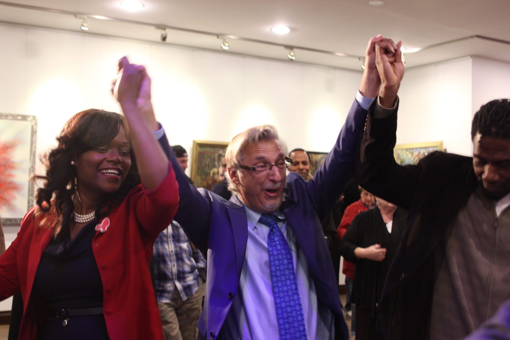 Rodneyse Bichotte, the Democratic nominee running for the 42nd Assembly District, left, host Mark Meyers Appel, center, and Councilman Jumaane Williams dance the hora at the opening of the Bridge Community Center. 