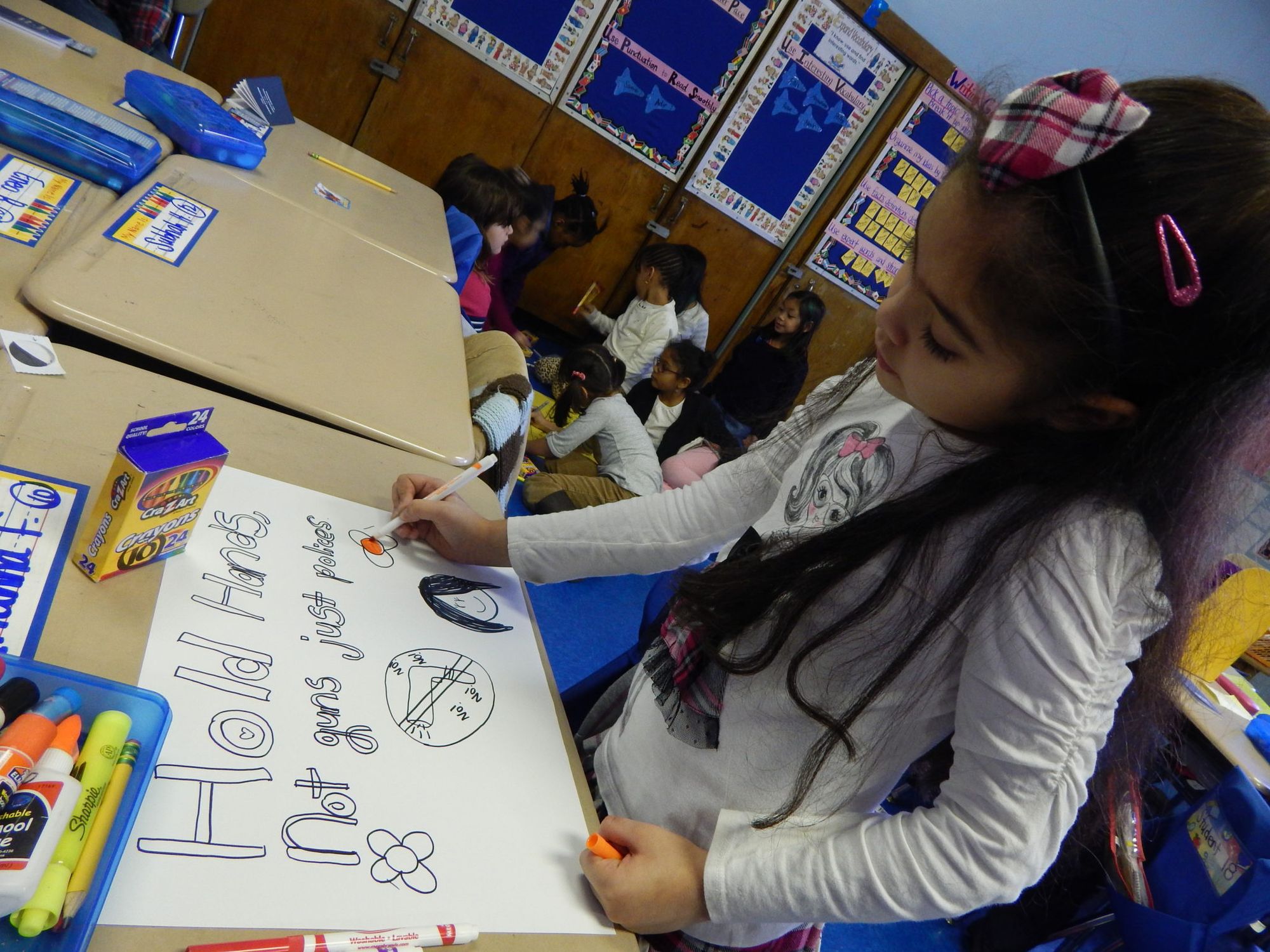 PS 139 student hold hands not guns