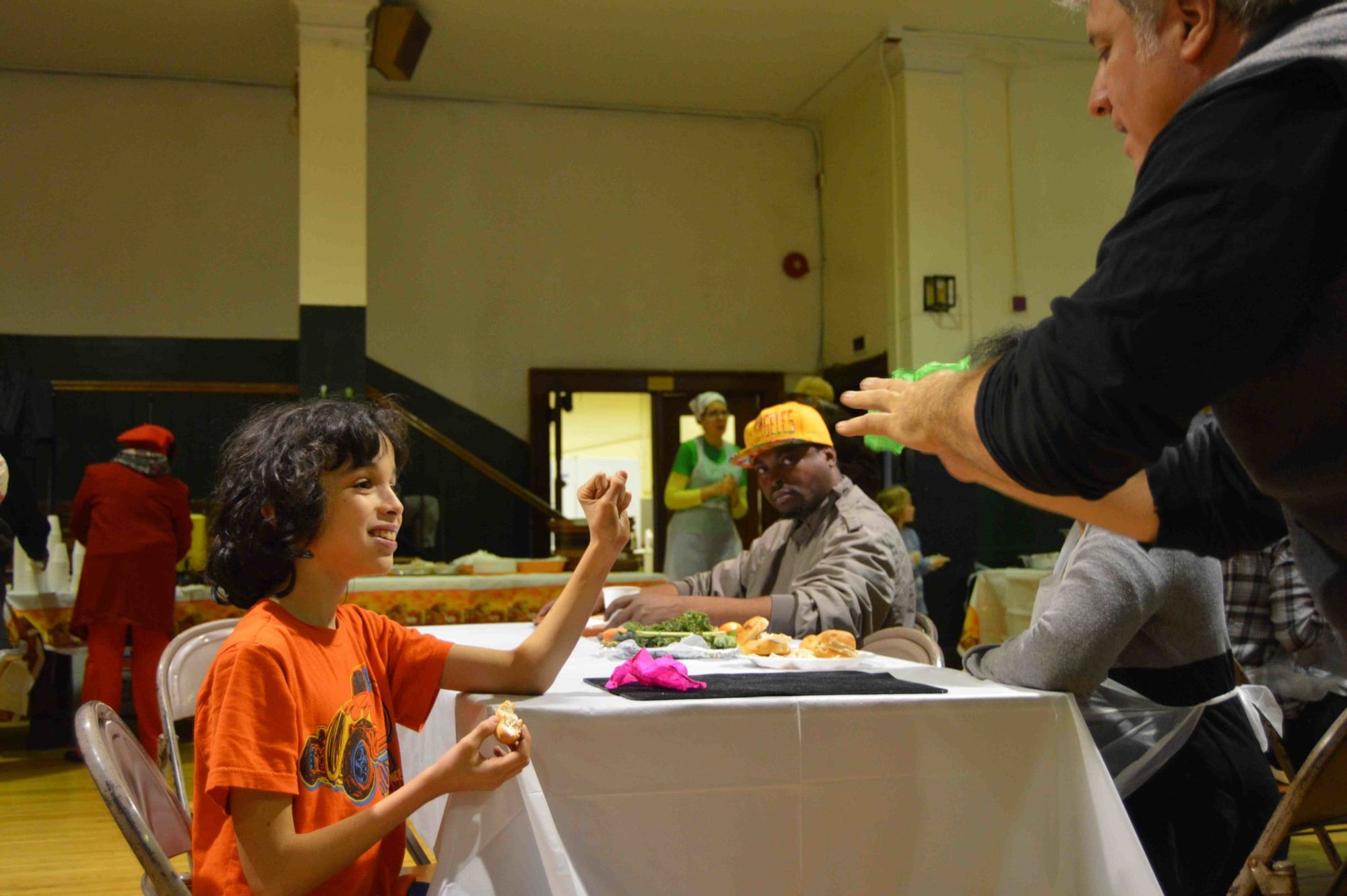 Nathan Thompson and one of the younger diners at the Thanksgiving luncheon.