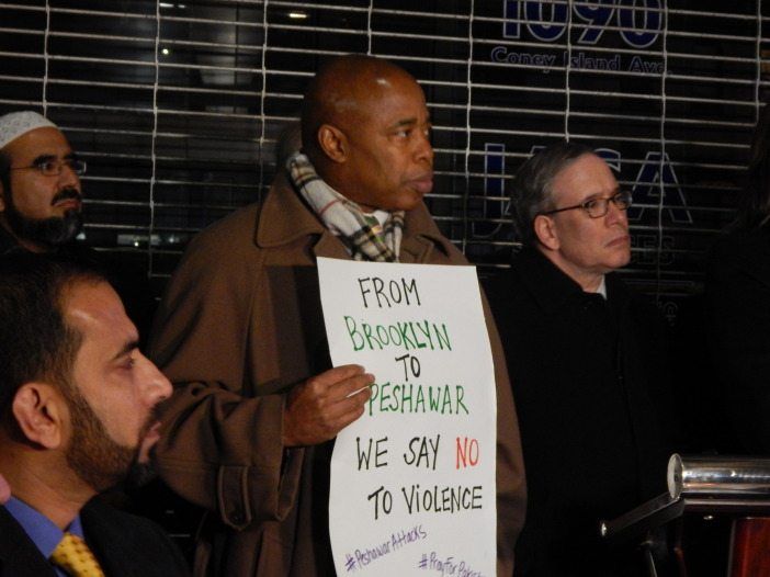 Peshawar vigil Eric Adams with poster