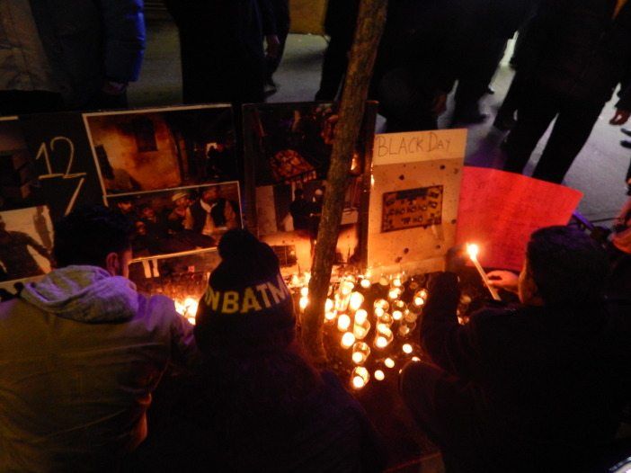 Peshawar vigil candles posters and people