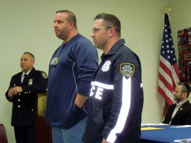 66th Precinct Commander Deddo announced "Cops of the Month" awards went to  Sgt.Wheeler, center, and Officer Josh Hull, right.