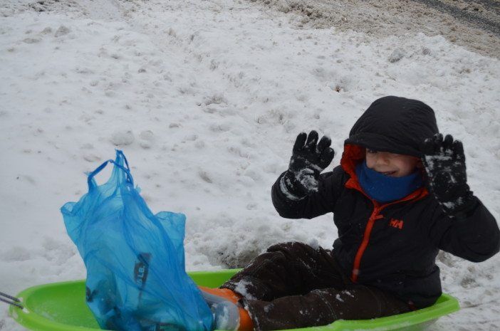 Hugo Smith snow sledding