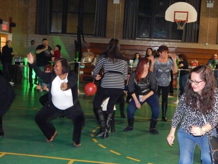 Neighbors danced into the night at the fundraiser. Photo by Michael Wright.