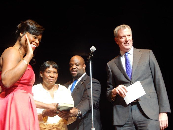 Assemblywoman Rodneyse Bichotte, members of her family, and Mayor Bill de Blasio during the swearing-in.